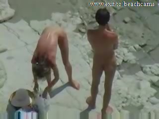 Spying lustful Couple at Nude Beach